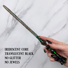 Charger l'image dans la galerie, A stunning black Flora magic wand featuring a delicate, translucent design with iridescent shimmering accents. The wand has a beautiful flower shaped base with a narrow shaft that sparkles in light, showcasing its intricate craftsmanship. Perfect for fantasy collectors, this wand embodies elegance and enchantment, making it a prized addition to any magical assortment.