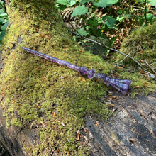 Load image into Gallery viewer, A stunning handcrafted Flora magic wand made with shimmering amethyst chips, showcasing a blend of purple hues. The wand has a gracefully tapered shaft that sparkles in light, showcasing its intricate craftsmanship. Perfect for fantasy collectors, this wand embodies elegance and enchantment, making it a prized addition to any magical assortment.