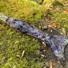 Load image into Gallery viewer, A stunning handcrafted Mertail magic wand made with shimmering amethyst chips, showcasing a blend of purple hues. The wand has a gracefully tapered shaft that sparkles in light, showcasing its intricate craftsmanship. Perfect for fantasy collectors, this wand embodies elegance and enchantment, making it a prized addition to any magical assortment.
