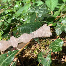 Load image into Gallery viewer, A stunning handcrafted Flora magic wand made with shimmering rose quartz chips, showcasing a blend of pink hues. The wand has a gracefully tapered shaft that sparkles in light, showcasing its intricate craftsmanship. Perfect for fantasy collectors, this wand embodies elegance and enchantment, making it a prized addition to any magical assortment.