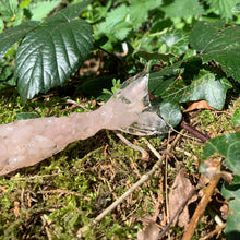 Load image into Gallery viewer, A stunning handcrafted Mertail magic wand made with shimmering rose quartz chips, showcasing a blend of pink hues. The wand has a gracefully tapered shaft that sparkles in light, showcasing its intricate craftsmanship. Perfect for fantasy collectors, this wand embodies elegance and enchantment, making it a prized addition to any magical assortment.