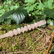 Charger l'image dans la galerie, A stunning handcrafted Orbit magic wand made with shimmering rose quartz chips, showcasing a blend of pink hues. The wand has a gracefully tapered shaft that sparkles in light, showcasing its intricate craftsmanship. Perfect for fantasy collectors, this wand embodies elegance and enchantment, making it a prized addition to any magical assortment.