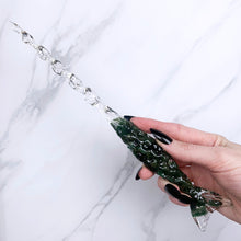 Load image into Gallery viewer, A stunning handcrafted Mertail magic wand made with shimmering aventurine chips, showcasing a blend of green hues. The wand has a gracefully tapered shaft that sparkles in light, showcasing its intricate craftsmanship. Perfect for fantasy collectors, this wand embodies elegance and enchantment, making it a prized addition to any magical assortment.