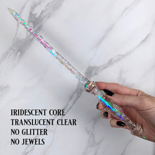 Charger l'image dans la galerie, A stunning clear Stiletto design magic wand featuring a delicate, translucent design with iridescent shimmering accents. The wand has a beautiful smooth handle that tapers to a point with a narrow shaft that sparkles in light, showcasing its intricate craftsmanship. Perfect for fantasy collectors, this wand embodies elegance and enchantment, making it a prized addition to any magical assortment.