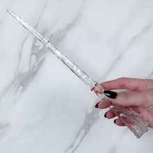 Load and play video in Gallery viewer, A stunning clear Star design magic wand featuring a delicate, translucent design with iridescent shimmering accents. The wand has a beautiful star shaped base that gracefully tapers to a point that sparkles in light, showcasing its intricate craftsmanship. Perfect for fantasy collectors, this wand embodies elegance and enchantment, making it a prized addition to any magical assortment.