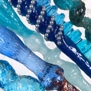 Close up of magic wands in various shades of blue