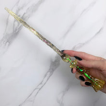 Charger l&#39;image dans la galerie, A stunning Yellow and Black  Flora magic wand featuring a delicate, translucent design with iridescent shimmering accents. The wand has a beautiful flower shaped base with a narrow shaft that sparkles in light, showcasing its intricate craftsmanship. Perfect for fantasy collectors, this wand embodies elegance and enchantment, making it a prized addition to any magical assortment.
