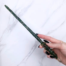 Lade das Bild in den Galerie-Viewer, A stunning handcrafted Twist magic wand made with shimmering aventurine chips, showcasing a blend of green hues. The wand has a gracefully tapered shaft that sparkles in light, showcasing its intricate craftsmanship. Perfect for fantasy collectors, this wand embodies elegance and enchantment, making it a prized addition to any magical assortment.
