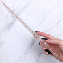Charger l&#39;image dans la galerie, A stunning handcrafted Stiletto magic wand made with shimmering rose quartz chips, showcasing a blend of pink hues. The wand has a gracefully tapered shaft that sparkles in light, showcasing its intricate craftsmanship. Perfect for fantasy collectors, this wand embodies elegance and enchantment, making it a prized addition to any magical assortment.
