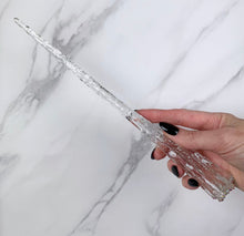 Lade das Bild in den Galerie-Viewer, A stunning clear Star design magic wand featuring a delicate, translucent design with iridescent shimmering accents. The wand has a beautiful star shaped base that gracefully tapers to a point that sparkles in light, showcasing its intricate craftsmanship. Perfect for fantasy collectors, this wand embodies elegance and enchantment, making it a prized addition to any magical assortment.
