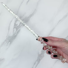 Charger et lire la vidéo dans la visionneuse de la Galerie, A stunning clear celestial-inspired Orbit design magic wand featuring a delicate, translucent design with iridescent shimmering accents. The wand has a beautiful handle with alternating hoops with a narrow shaft that sparkles in light, showcasing its intricate craftsmanship. Perfect for fantasy collectors, this wand embodies elegance and enchantment, making it a prized addition to any magical assortment.
